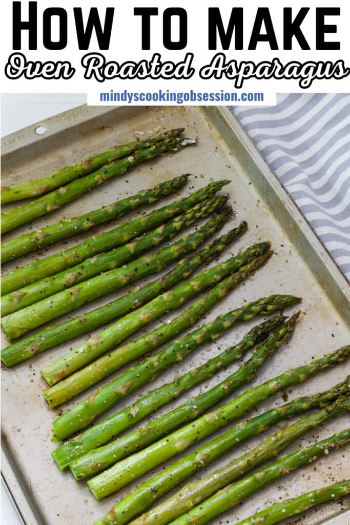 The cooked asparagus on a baking sheet, the recipe title is in text at the top so the image can be pinned on Pinterest.