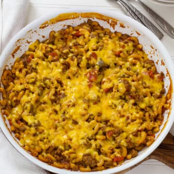 Feature image showing the skillet full of cooked cheesy chili mac.