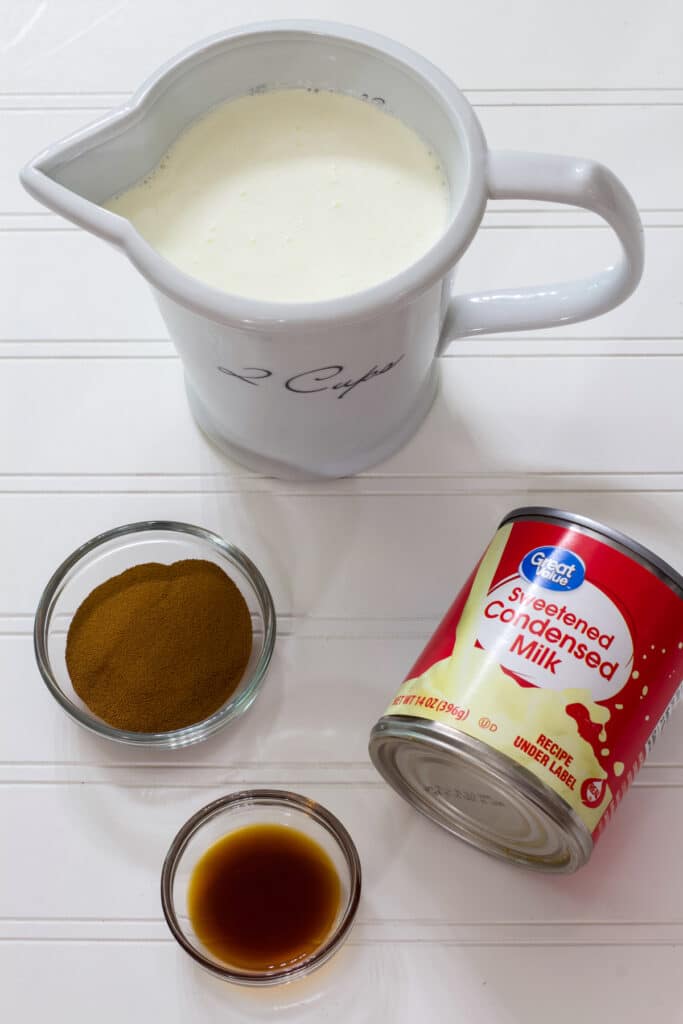 The heavy cream, sweetened condensed milk, instant espresso powder and vanilla measured out ready to make the Homemade Coffee Ice Cream (easy no-churn recipe).